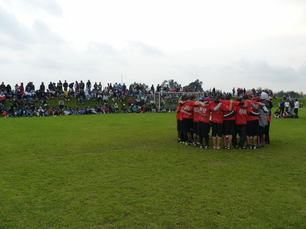 Euforia talks during a timeout as spectators look on at the 2012 Colombian Ultimate Nationals.