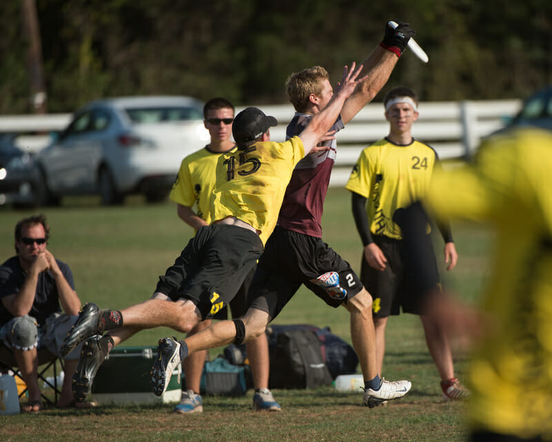 Truck Stop's Sean Keegan catches the disc in front of Southpaw's Greg Owens.