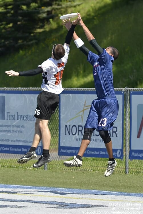 The Connecticut Constitution's John Korber catches a hammer over his Rhode Island Rampage defender in an American Ultimate Disc League game.