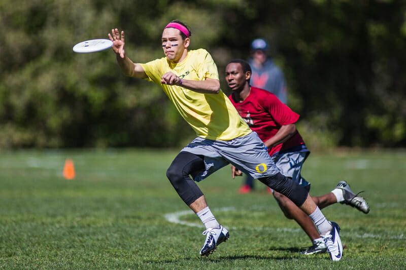Oregon's Aaron Honn catches the disc against Carleton at the 2013 Stanford Invite.