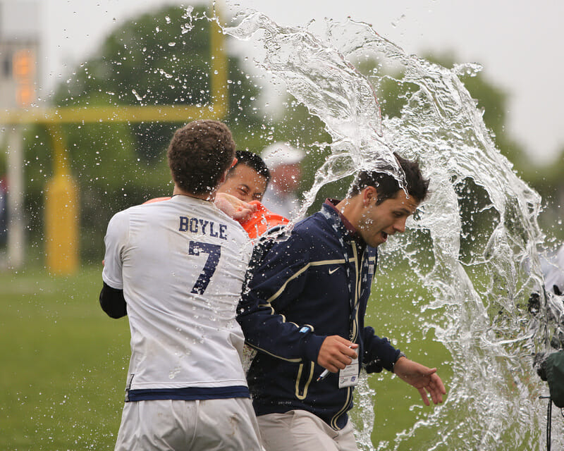 PItt coach Nick Kaczmarek gets the water jug treatment after Pitt's win over Central Florida in the finals of the D-I College Championships.
