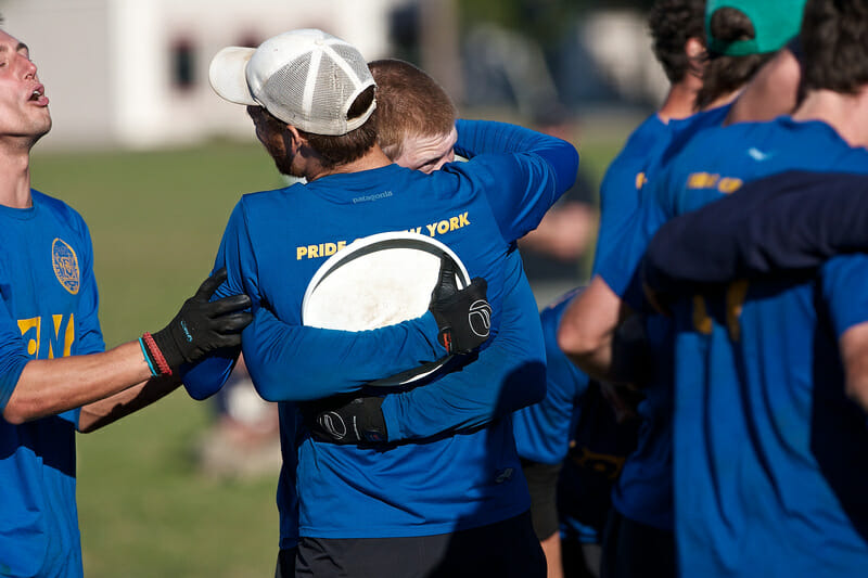 PoNY's Chris Mazur hugs a teammate after catching the game-winning score against Garuda.