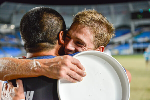 Ryan Farrell (right) and coach Matt Tsang embrace after Team USA won gold at the 2013 World Games. Photo: CBMT Creative.