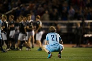 The Boston Whitecaps' Jack Hatchett looks on as the DC Current celebrate their win.