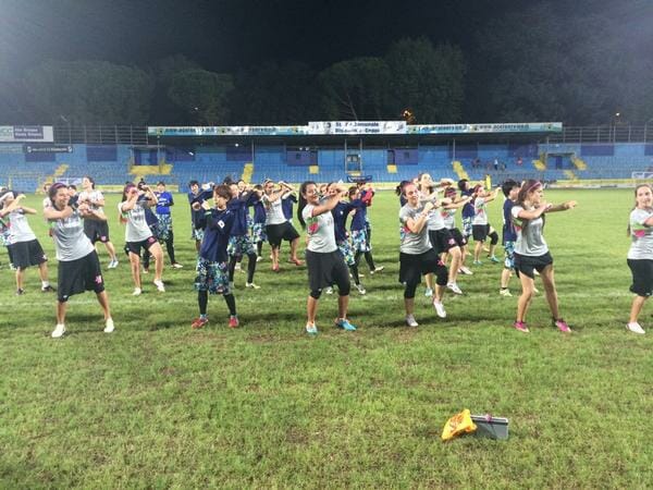 MUD and Revolution dance together after their game.