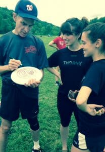 Bill Nye signing a disc for some Cornell Roses players.