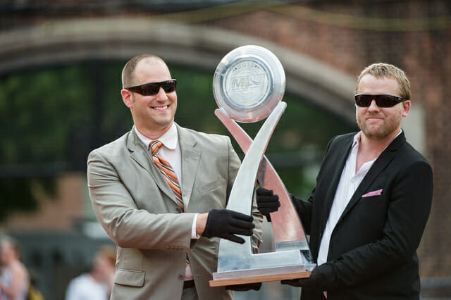 Jeff Snader (left) and Nic Darling presenting the MLU Championship trophy.