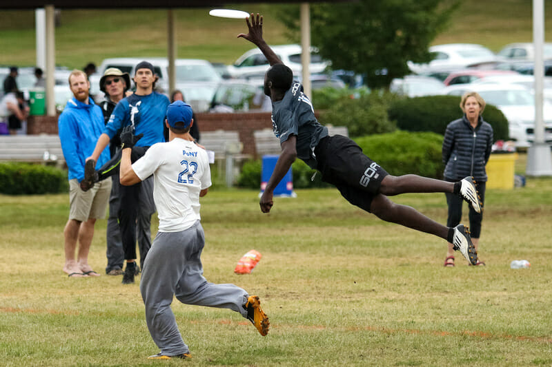 Toronto GOAT's Remy Ojo flies for a block. Photo: Paul Rutherford -- UltiPhotos.com