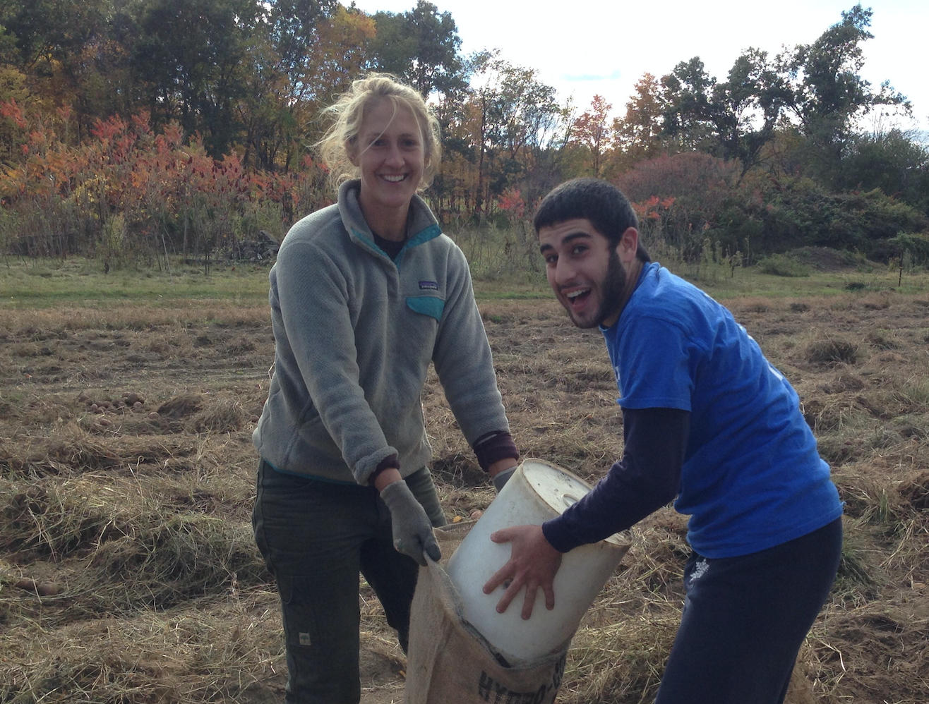 UMass requires all club players to perform community service. Captain Ben Sadok helps Ultiworld's Player of the Year Leila Tunnell pick potatoes at Brookfield Farm in Amherst. Bonding=buy-in.
