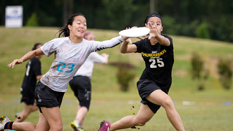 Linnea Soo gets the block against Ester Au of UBC. Photo: Paul Andris -- UltiPhotos.com